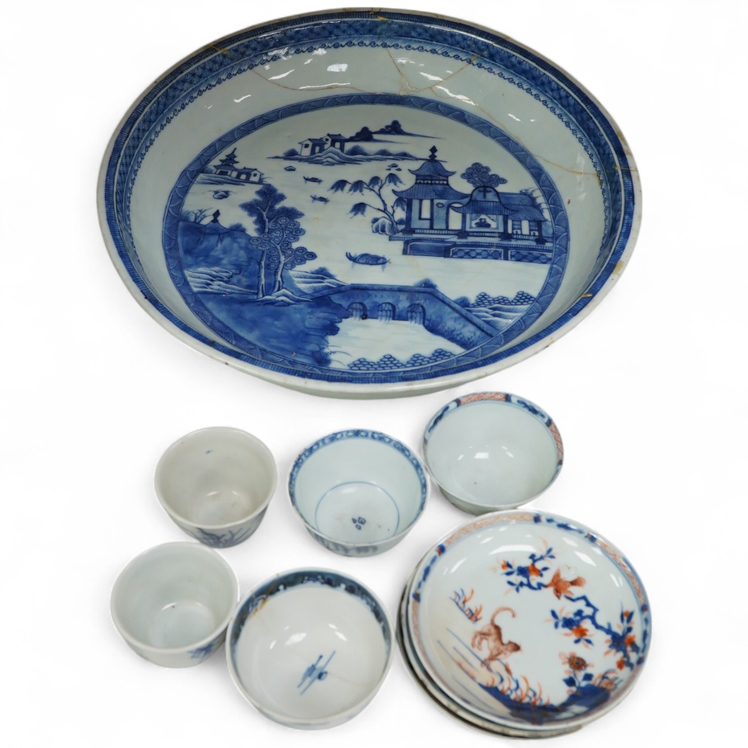 A collection of 18th century and later Chinese porcelain to include tea bowls and saucers and a large dish (a.f), largest 33cm in diameter